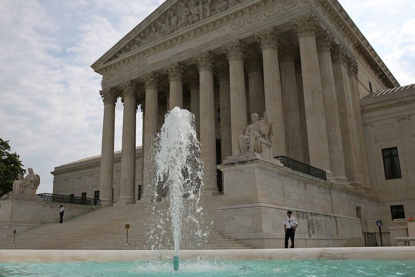 WASHINGTON, DC - JUNE 09: A guard stands outside the U.S. Supreme Court on June 9, 2014 in Washington, DC. The high court ruled today by 7 to 2 margin that homeowners in North Carolina can not sue a company that contaminated their drinking water because a state deadline has passed. A North Carolina state law strictly prohibits any lawsuit brought more than 10 years after the contamination even if residents did not realize their water was polluted until years later. (Photo by Mark Wilson/Getty Images) ** OUTS - ELSENT, FPG - OUTS * NM, PH, VA if sourced by CT, LA or MoD **
