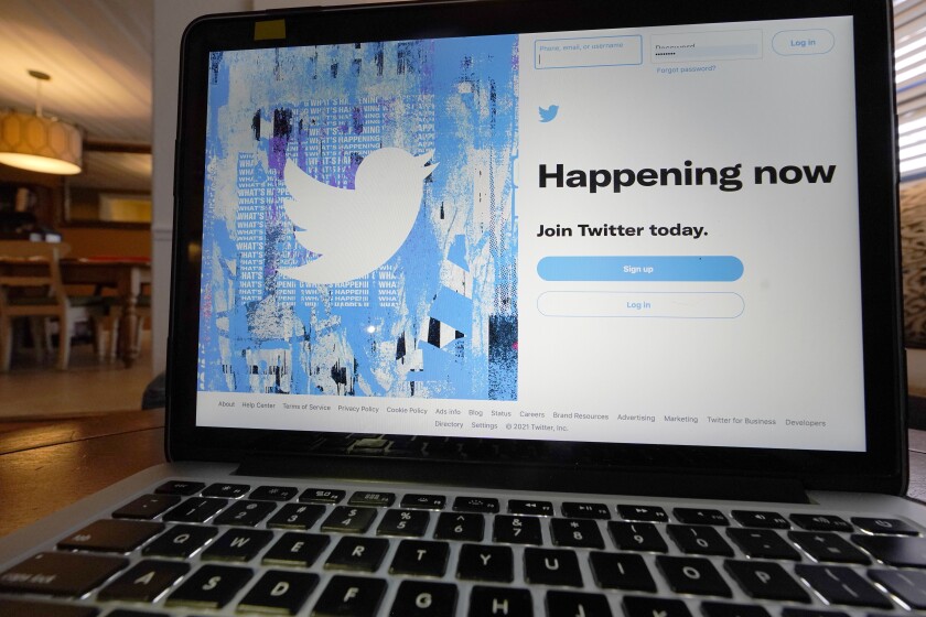 The login/sign up screen for a Twitter account is seen on a laptop computer Tuesday, April 27, 2021, in Orlando, Fla. After its labels on election-related misinformation became a regular sighting in the weeks leading up to and following the 2020 U.S. presidential election, Twitter is now working on overhauling them in an attempt to make them more useful and easier to notice, among other things. Beginning Thursday, July 1, the company is taking comments from its U.S. users on the redesigns. (AP Photo/John Raoux)