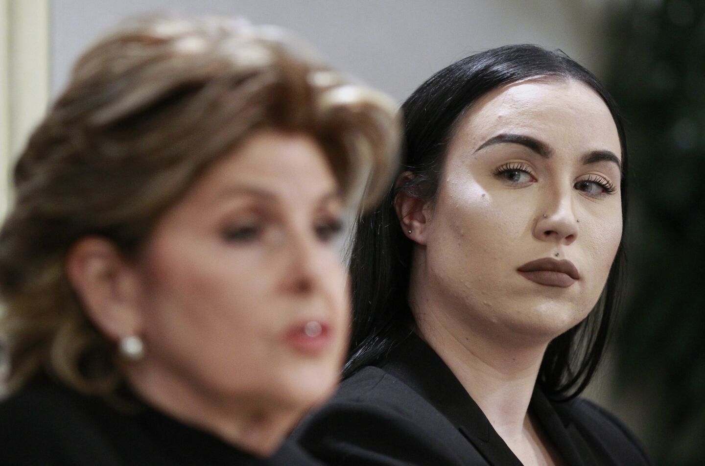 Attorney Gloria Allred speaks as former Marine Erika Butner watches her as they and active duty Marine Lance Cpl. Marisa Woytek hold a news conference on the Marines United scandal at the Holiday Inn Oceanside Marina in Oceanside on Thursday.