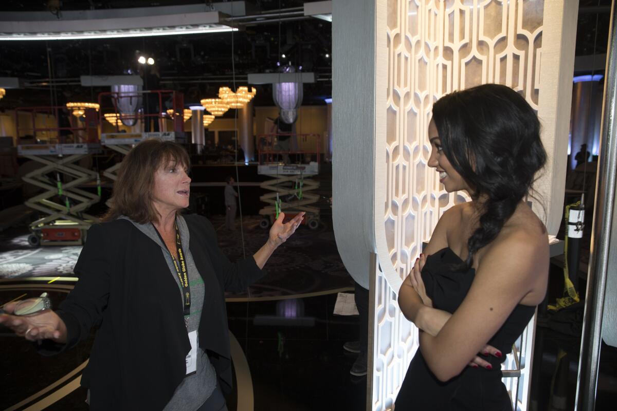 "Everyone thinks it's so simple, but it's not," said Debbie Williams, left, who this year will serve as the Globes' lead stage manager for the 29th time when the show airs Sunday night. Her pupil: Corinne Foxx, 2016's Miss Golden Globe.
