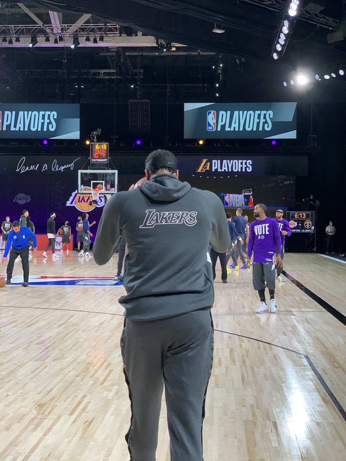 Anthony Davis jogs onto the court to join his Lakers teammates for practice.