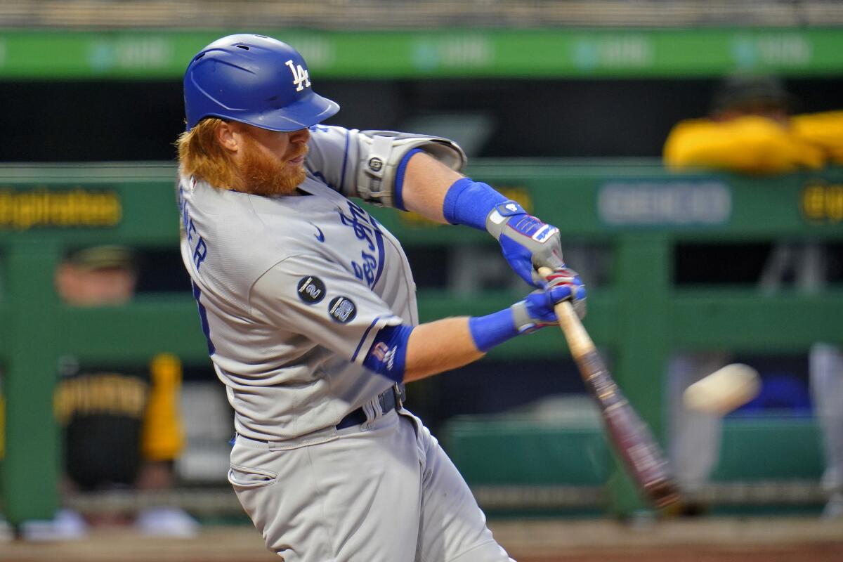 Dodgers third baseman Justin Turner hits a solo home run off Pittsburgh Pirates starting pitcher Tyler Anderson.