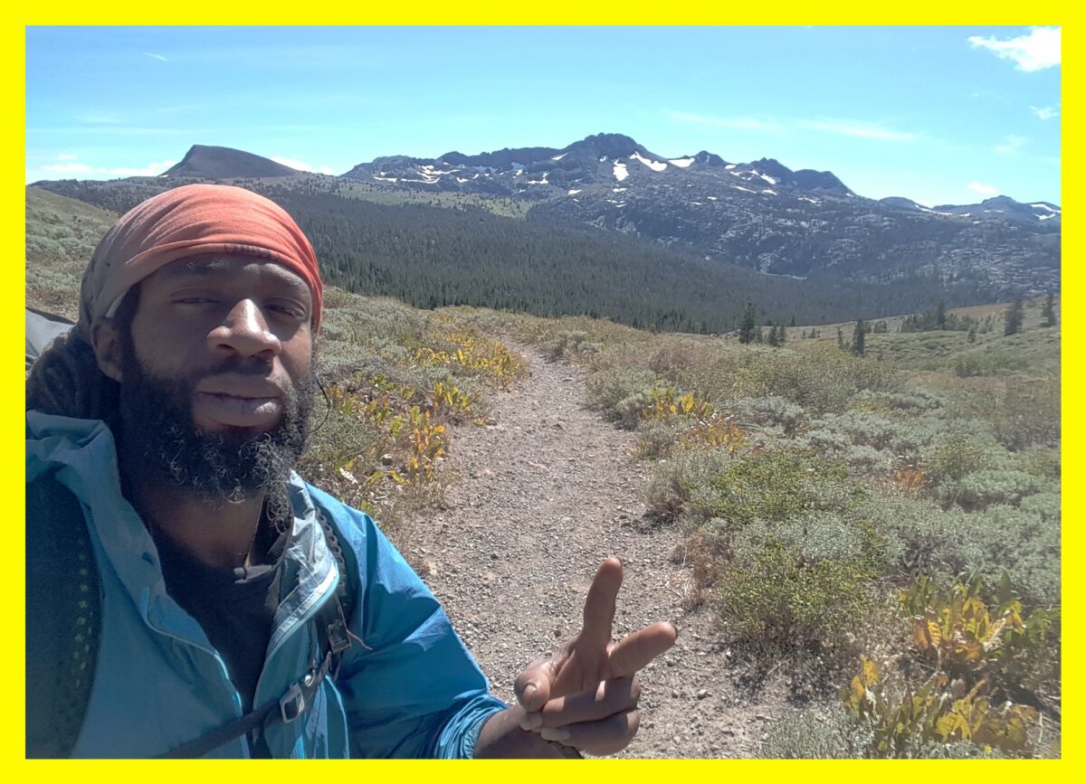 Akuna Robinson takes a selfie on a hike