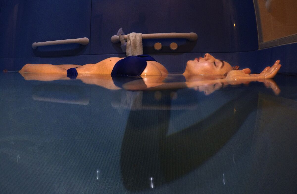 Ilona Houhanissyan, an employee at Just Float in Pasadena, floats in epsom salt, mixed in 11 inches of water, at a temperature of 94.5 degrees.