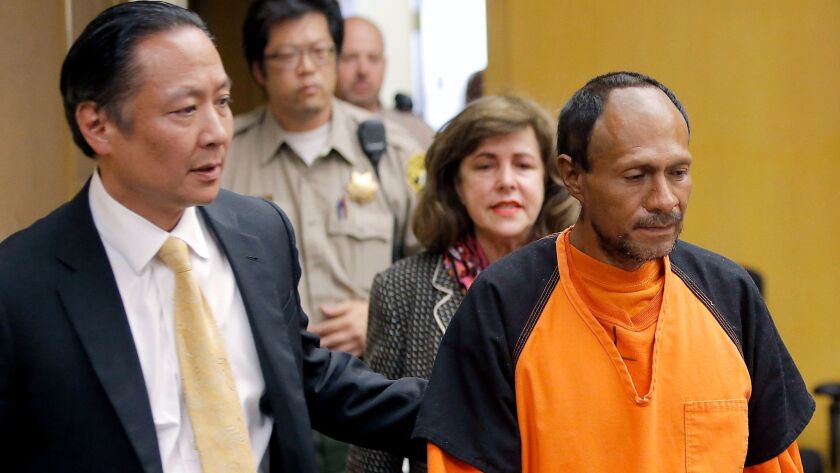In this July 7, 2015 file photo, Jose Ines Garcia Zarate, right, is led into the courtroom by San Francisco Public Defender Jeff Adachi, left, and Assistant Dist. Atty. Diana Garcia, center, for his arraignment.