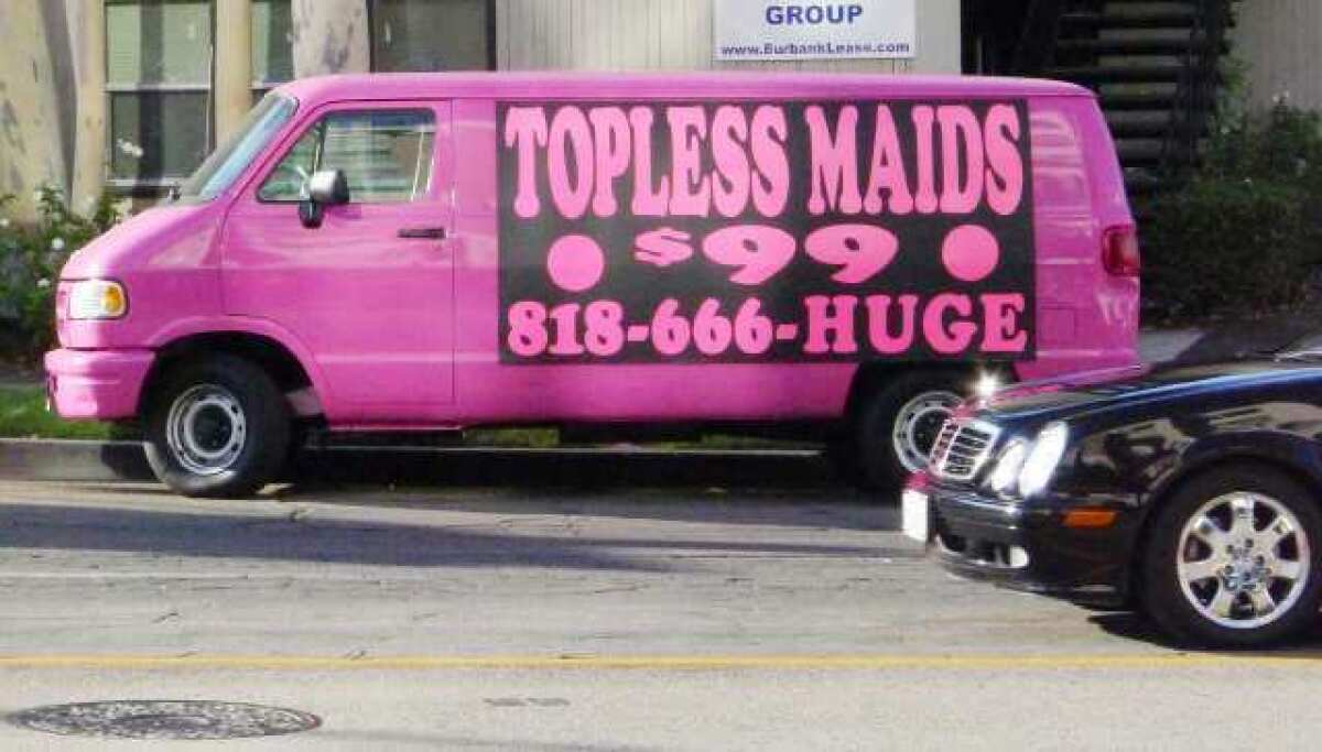 A van touting topless maids parked on Olive Avenue in Burbank last year.