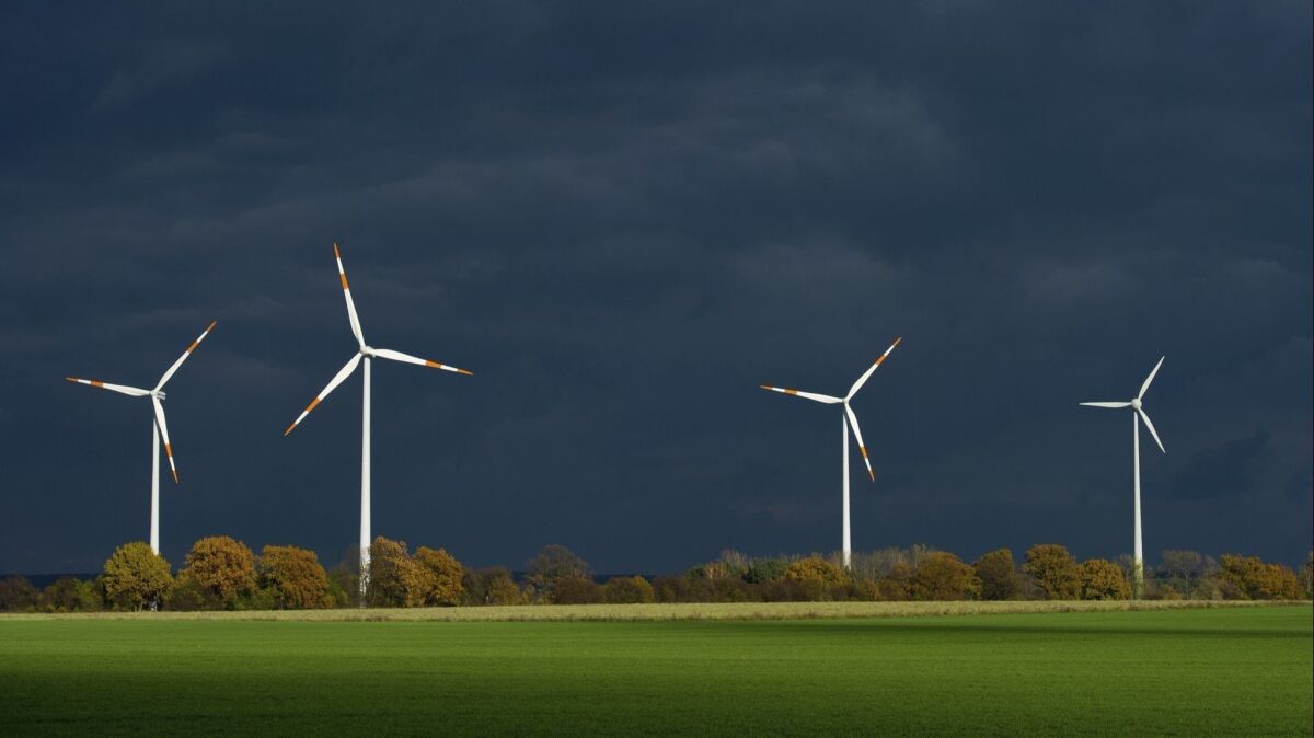 Wind turbines in Furstenwalde, in eastern Germany. Wind power accounts for 160,000 jobs in Germany but the country's integration of renewable energy sources has been less than smooth.