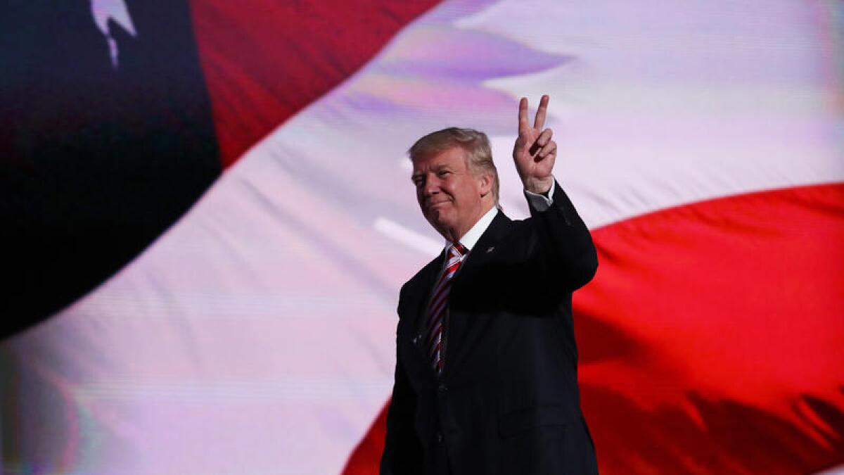 Republican presidential candidate Donald Trump gestures after vice presidential candidate Mike Pence delivered his speech on the third day of the Republican National Convention in Cleveland.