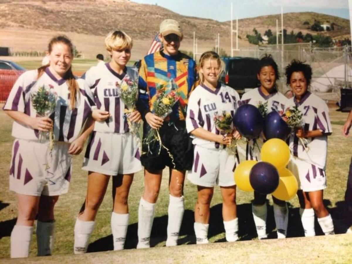 Shannon Pennington (14) stands on the field with five Cal Lutheran teammates during her senior season.