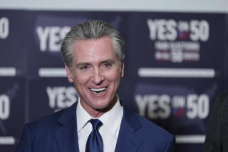 California Gov. Gavin Newsom answers questions after signing legislation calling for a special election on redistricting.