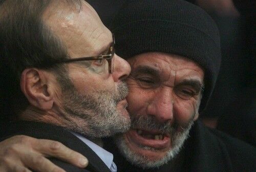 Fayez Mughniyah, father of Imad Mughniyah, comforts his own father in southern Beirut.