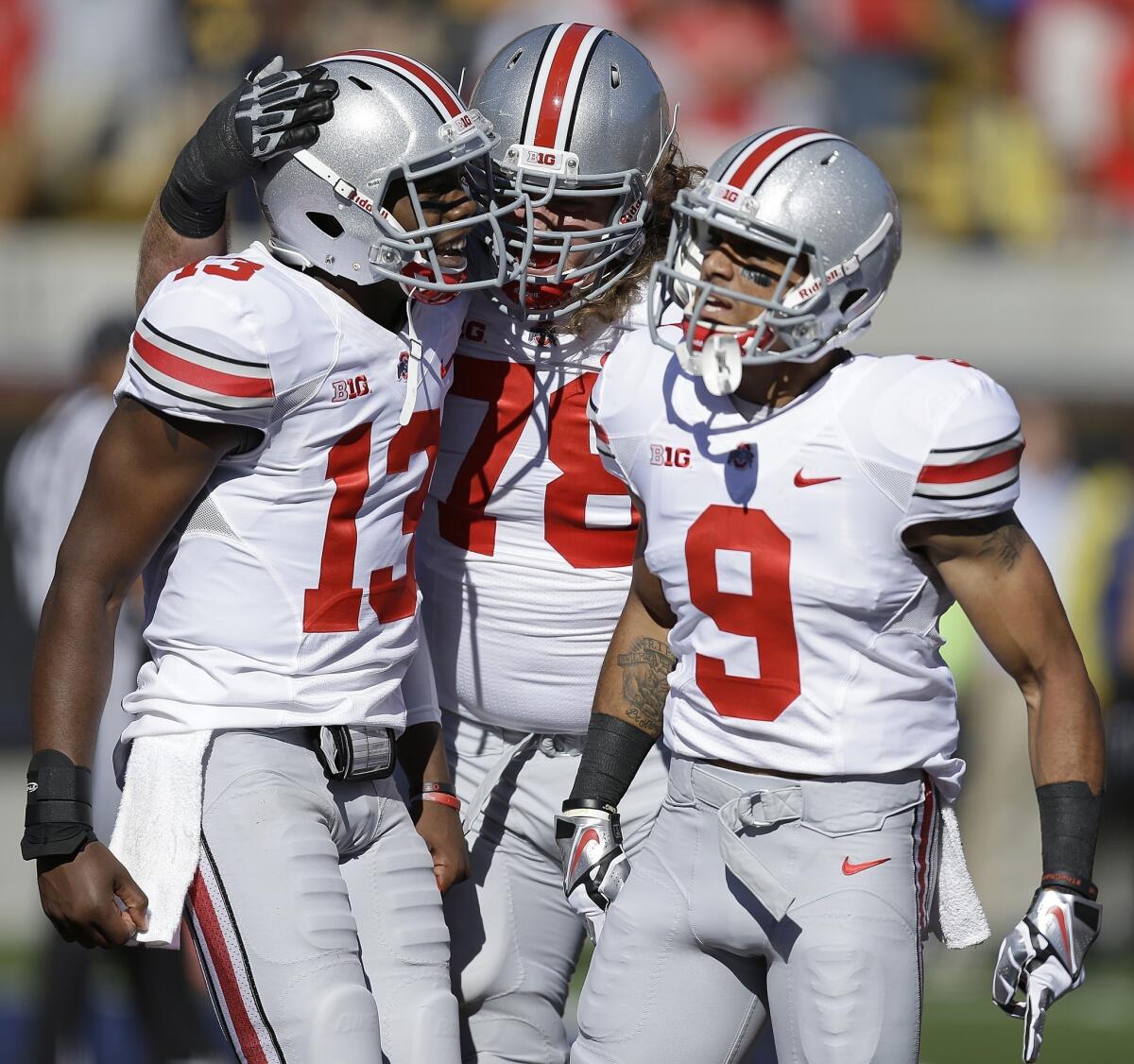 Ohio State's Kenny Guiton, left, Andrew Norwell, center, and Devin Smith celebrate a touchdown against California on Saturday. Expect to see plenty of scoring celebrations by the Buckeyes this week.