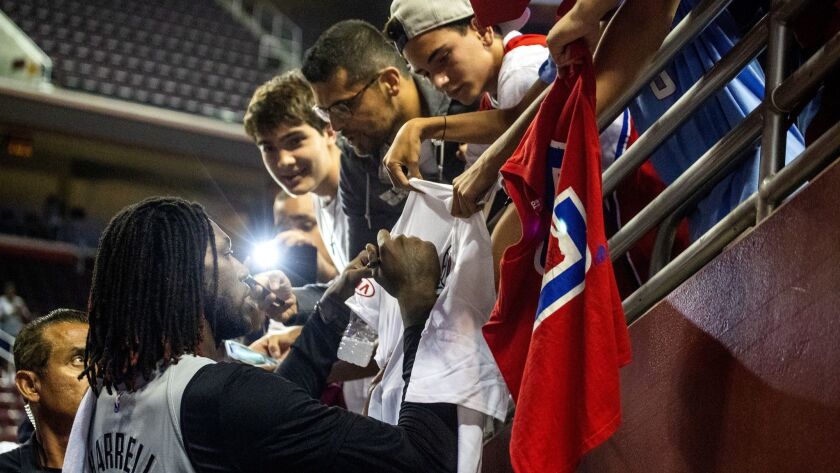 Clippers center Montrezl Harrell signs autographs for fans during an open practice earlier this season at USC.