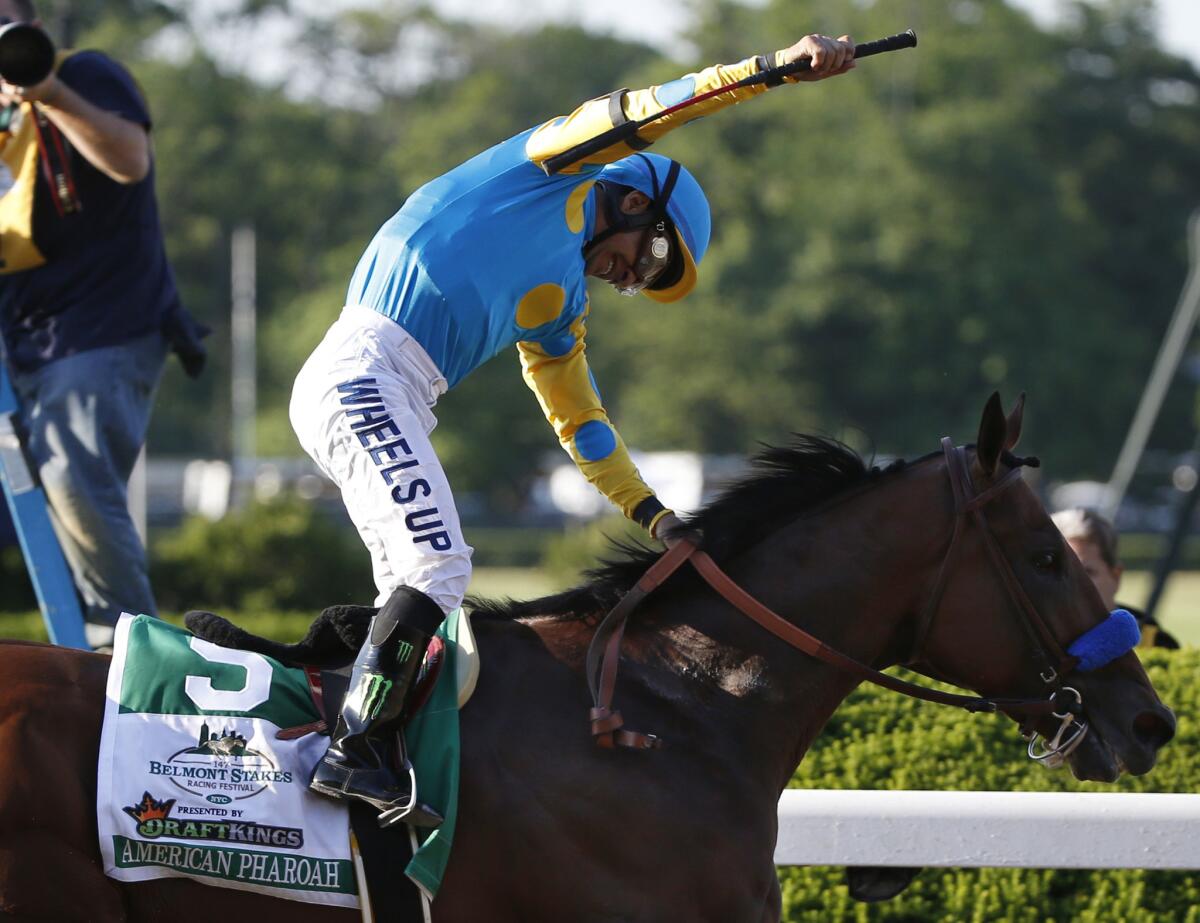 Victor Espinoza reacts after crossing the finish line with American Pharoah to win the 147th running of the Belmont Stakes horse race at Belmont Park, Saturday, June 6, 2015. American Pharoah became the first horse to win the Triple Crown since Affirmed won it in 1978.