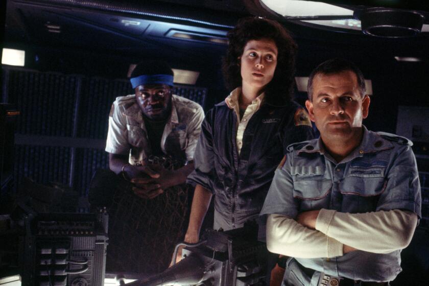 L–R: Parker (Yaphet Kotto), Ripley (Sigourney Weaver) and Ash (Ian Holm) face a desperate situation the movie Alien: The Director's Cut. Photo by Robert Penn