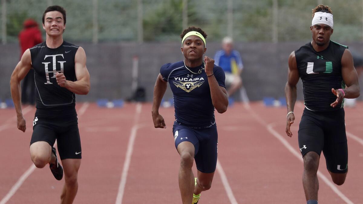 Yucaipa's Asani Hampton, center, pulls ahead of Trabuco Hills' Jake Burns, left, and Upand's Caleb Lutalo Roberson in the Boys Division I 100-meter dash during the CIF Southern Section Division Finals at El Camino College in Torrance.