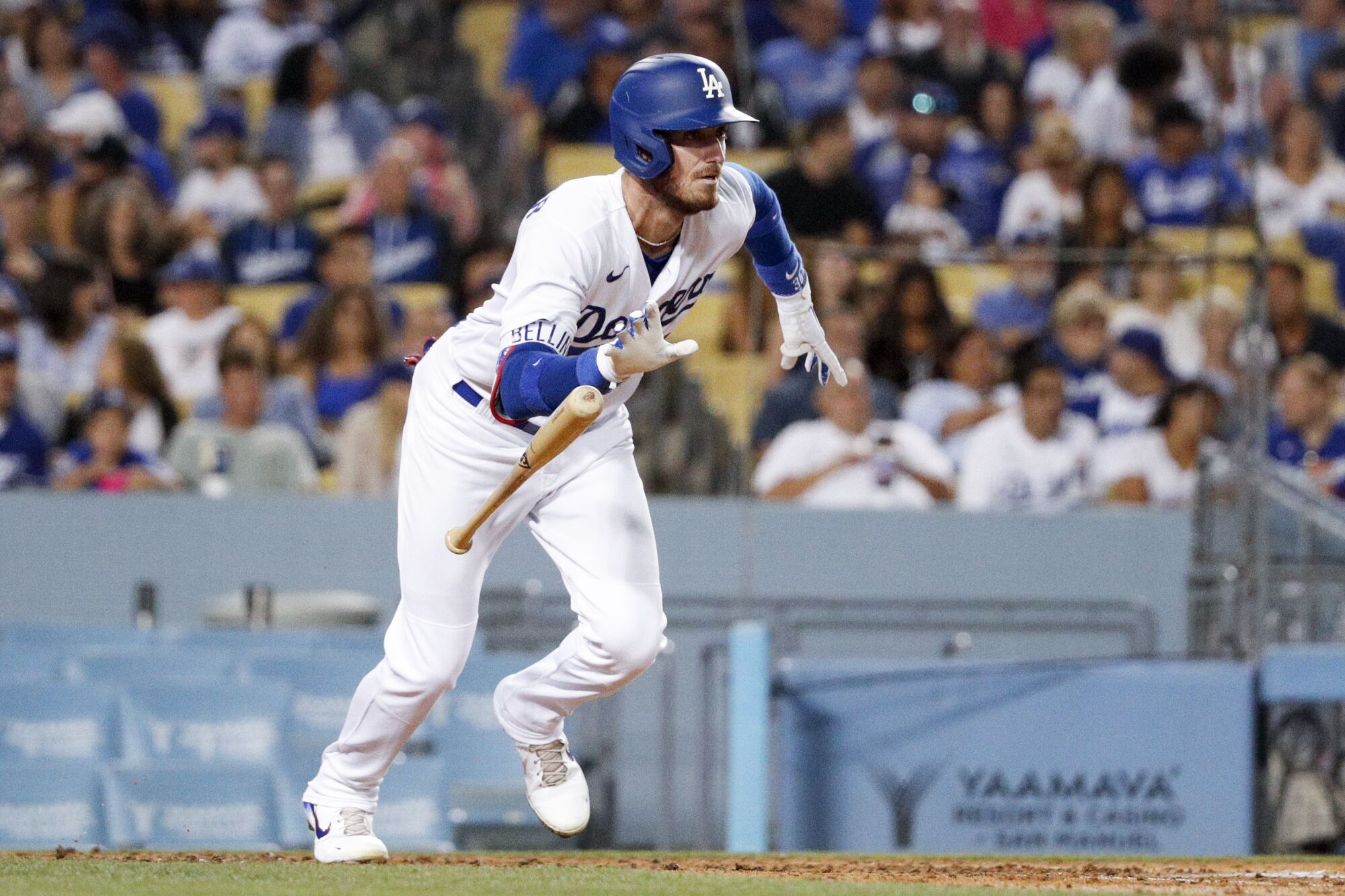 The Dodgers' Cody Bellinger tosses his bat after hitting a single against the Colorado Rockies Wednesday