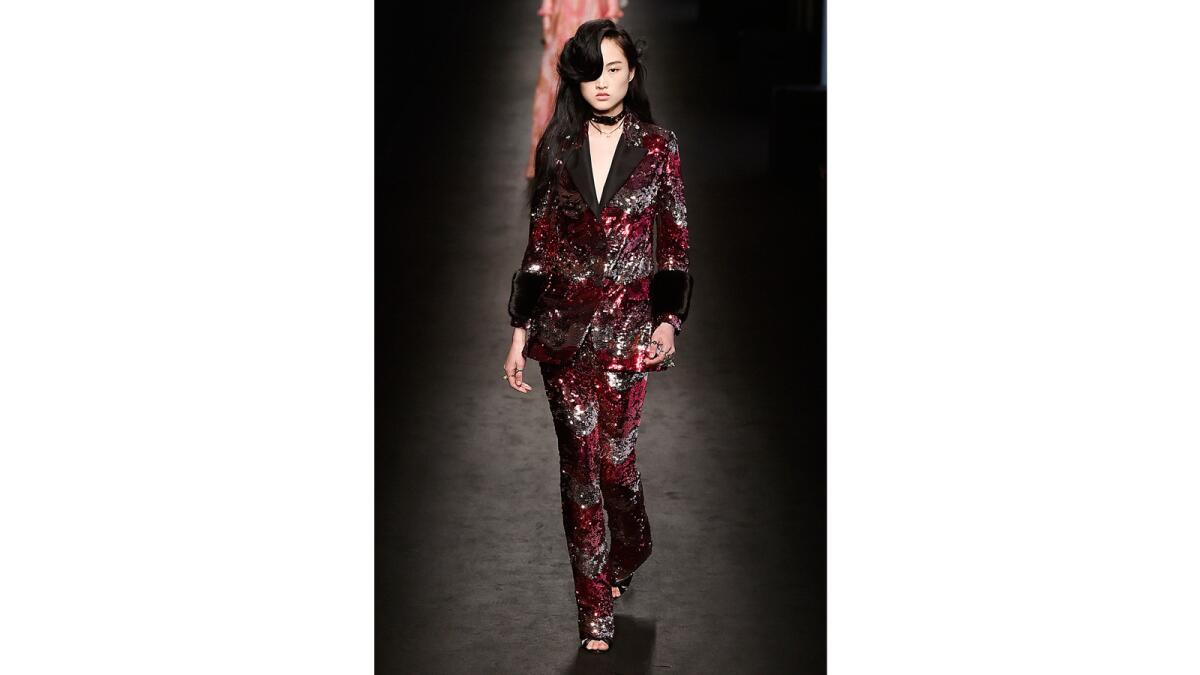A model walks the runway at the Gucci Fall/Winter 2016 fashion show during Milan Fashion Week.