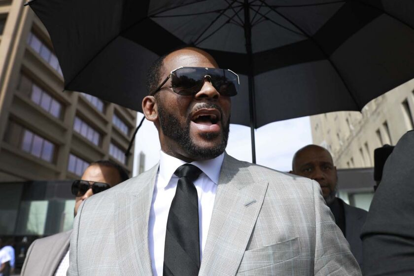 Musician R. Kelly departs the Leighton Criminal Court building after pleading not guilty to 11 additional sex-related charges, Thursday, June 6, 2019, in Chicago. (AP Photo/Amr Alfiky)