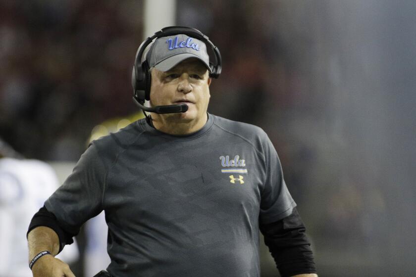 UCLA head coach Chip Kelly looks on during the second half of an NCAA college football game.