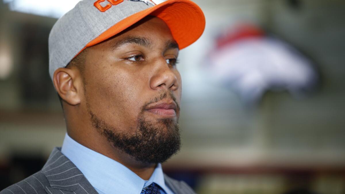 Bradley Chubb, the Denver Broncos' first-round selection with the fifth overall pick in the NFL draft, considers a question from a reporter after he was introduced to the media, April 27, 2018, at the team's headquarters in Englewood, Colo.