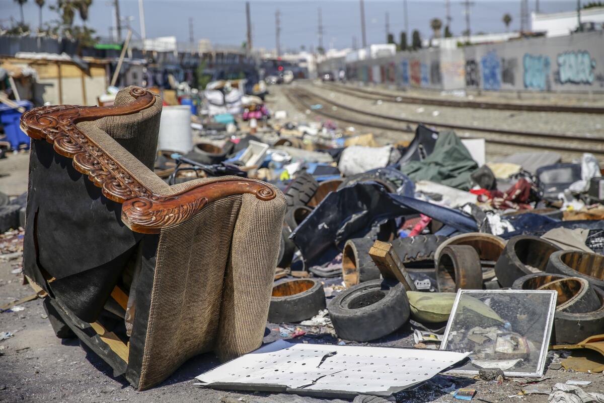 Piles of trash remain near 25th Street and Long Beach Avenue.