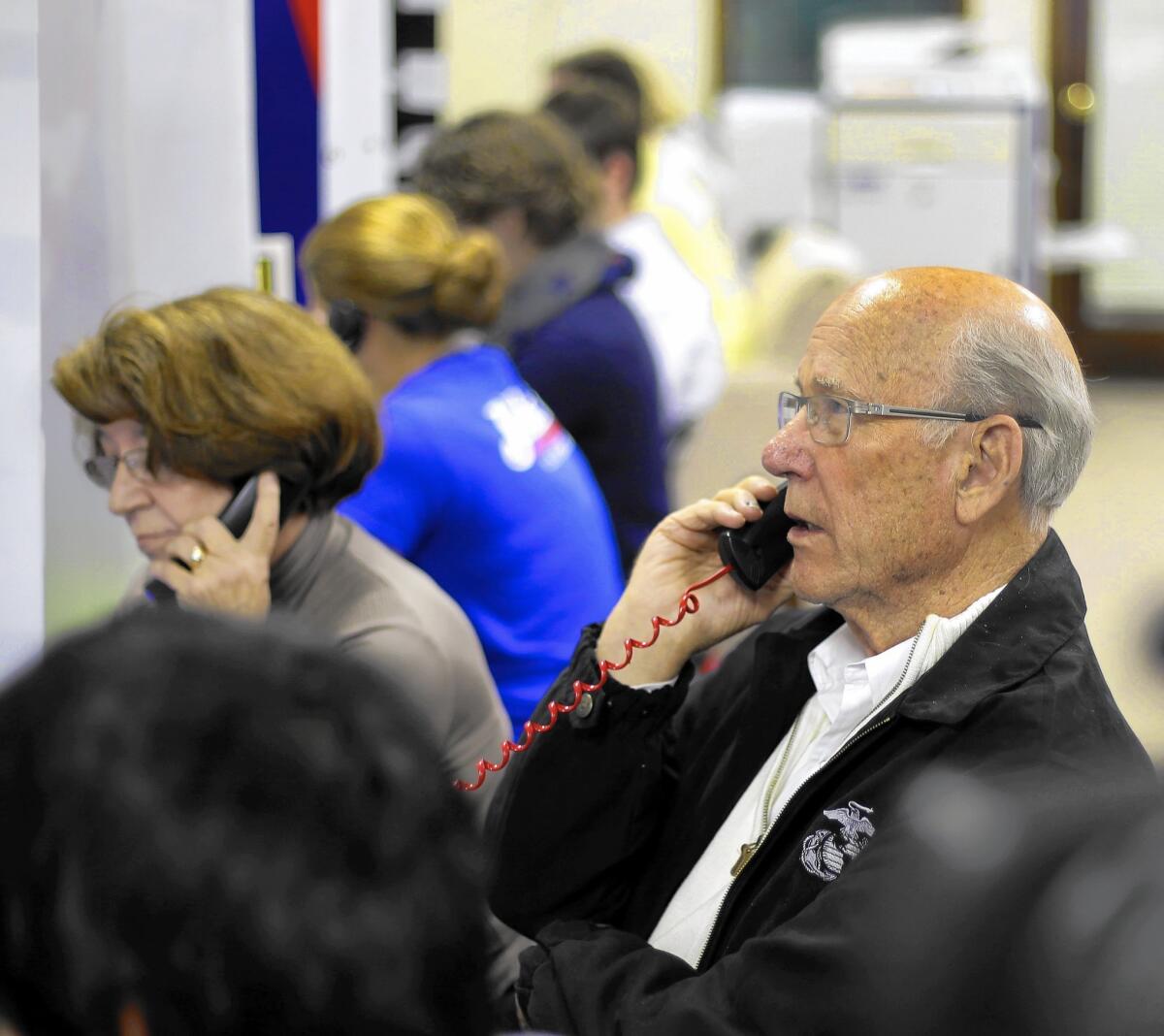 Sen. Pat Roberts calls a prospective voter on election day. The Kansas incumbent was hurt by a confluence of circumstances and his own slip-ups, but ultimately prevailed.