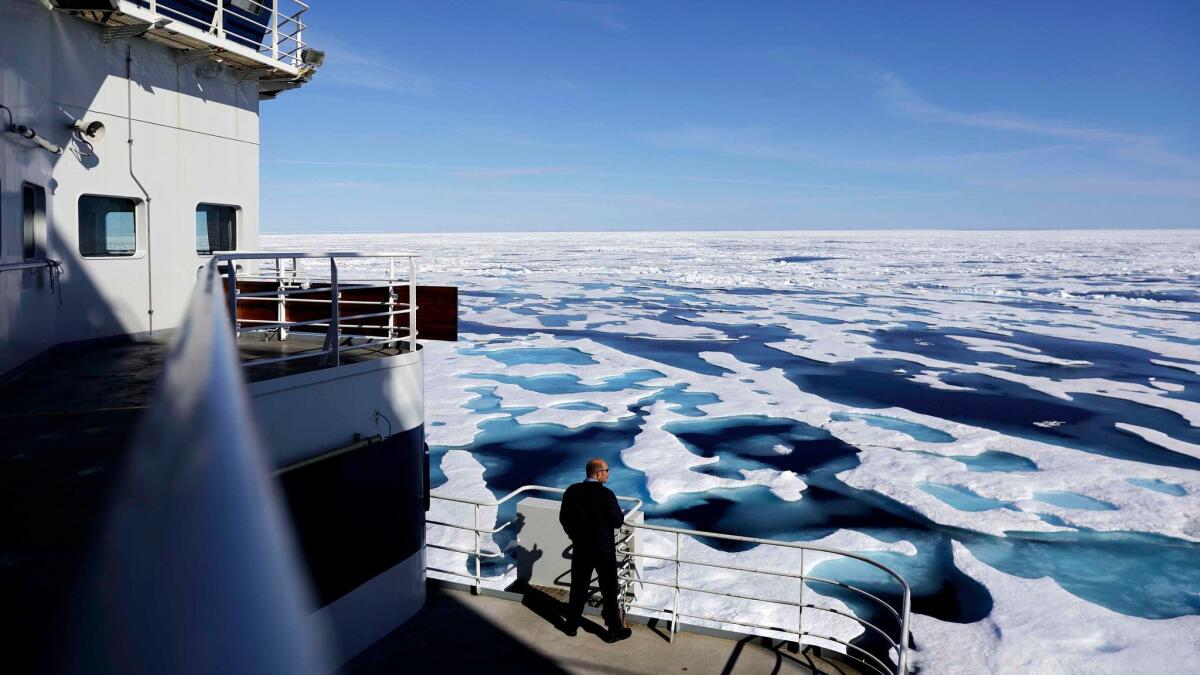 Canadian Coast Guard Capt. Victor Gronmyr looks out over the ice covering the Victoria Strait as the Finnish icebreaker MSV Nordica traverses the Northwest Passage through the Canadian Arctic Archipelago on July 22, 2017.
