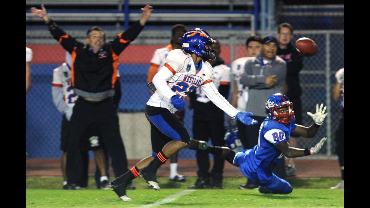 Serra receiver Kobe Smith can't make the catch as Westlake's Anthony Gravink deflects the pass in the first quarter Friday night in a Pac-5 Division playoff game.
