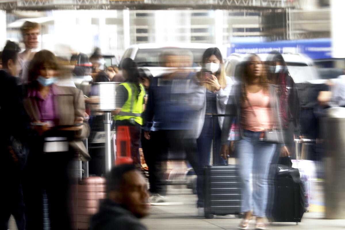 A reflected image of people at an airport.