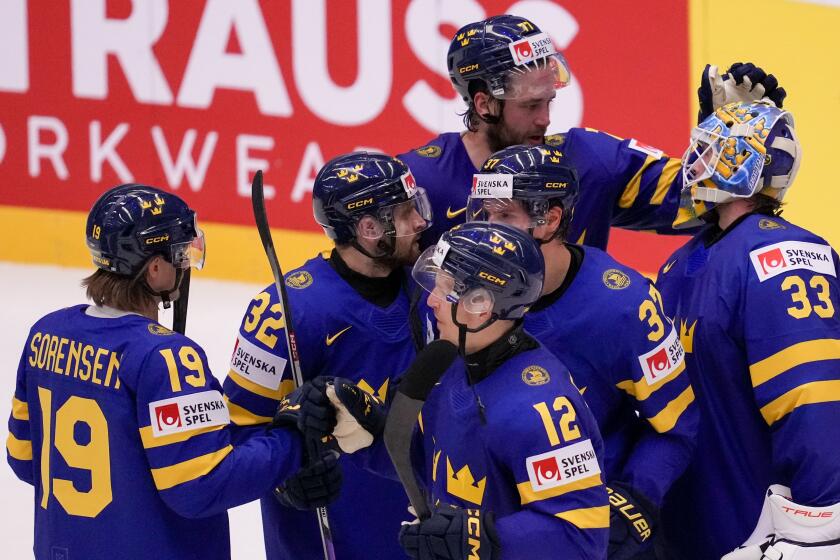 Sweden players celebrate at the end of the preliminary round match between Sweden and France at the Ice Hockey World Championships in Ostrava, Czech Republic, Monday, May 20, 2024. (AP Photo/Darko Vojinovic)