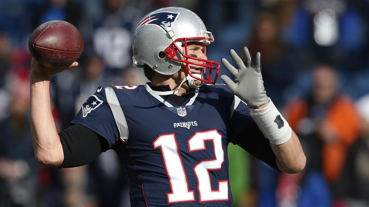 New England Patriots quarterback Tom Brady warms up before an NFL football game against the Miami Dolphins on Nov. 26, 2017, in Foxborough, Mass.