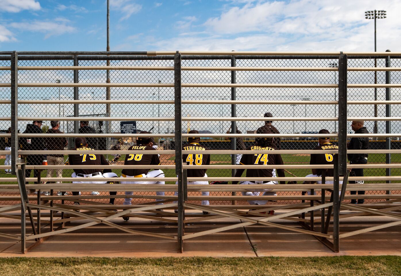 Padres pitchers wait before their turn in live batting practice during a spring training practice at the Peoria Sports Complex on Tuesday, Feb. 21, 2023 in Peoria, AZ.