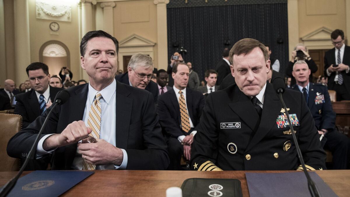 FBI Director James Comey, left, and Michael Rogers, director of the National Security Agency, at Monday's hearing.