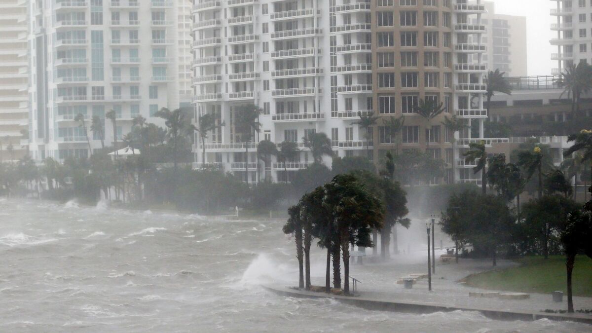 Waves crash over a seawall at the mouth of the Miami River from Biscayne Bay, Fla., as Hurricane Irma passes by Miami on Sept. 10.