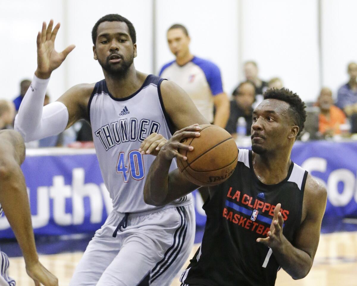 Clippers forward Jordan Hamilton looks for a way to the basket against Thunder forward James Southerland during an NBA summer league game in July.