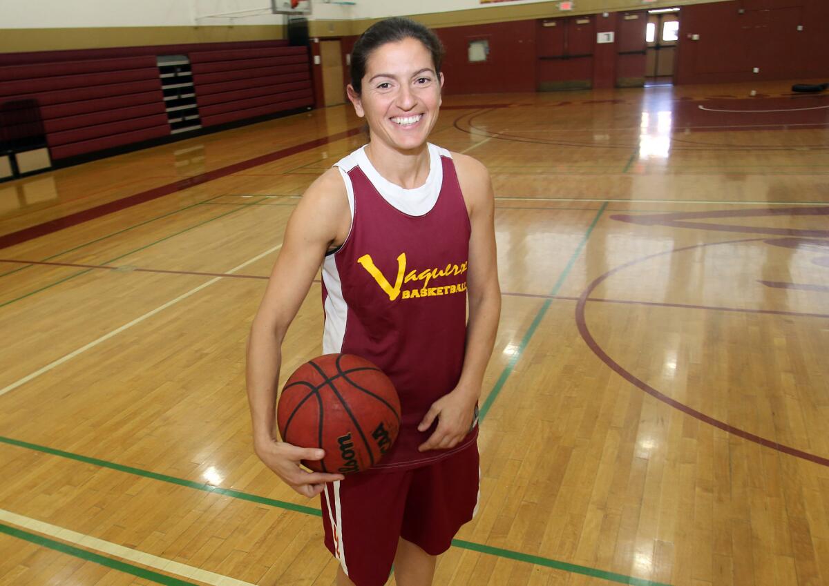 Vicky Oganyan, the head coach for the Burroughs girls' basketball team, is also a point guard for Glendale Community College women's squad.