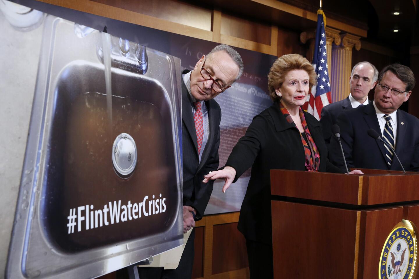 U.S. Sen. Debbie Stabenow, D-Mich., second from left, accompanied by Sen. Charles Schumer, D-N.Y., from left, Sen. Bob Casey, D-Pa., and Sen. Gary Peters, D-Mich., discusses proposed legislation to help Flint, Mich., with its water crisis during a news conference Jan. 28, 2016, in Washington.