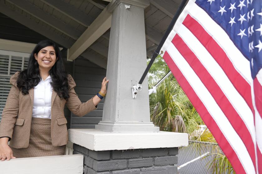 Florida state Rep. Anna Eskamani poses out front of her office Wednesday, March 27, 2024, in Orlando, Fla. For the first time in 27 years, the U.S. government is announcing changes to how it categorizes people by race and ethnicity. "It feels good to be seen," said Eskamani, whose parents are from Iran. (AP Photo/John Raoux)