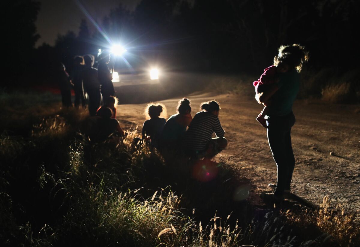 U.S. Border Patrol agents arrive to detain Central American asylum seekers at the border near McAllen, Texas.