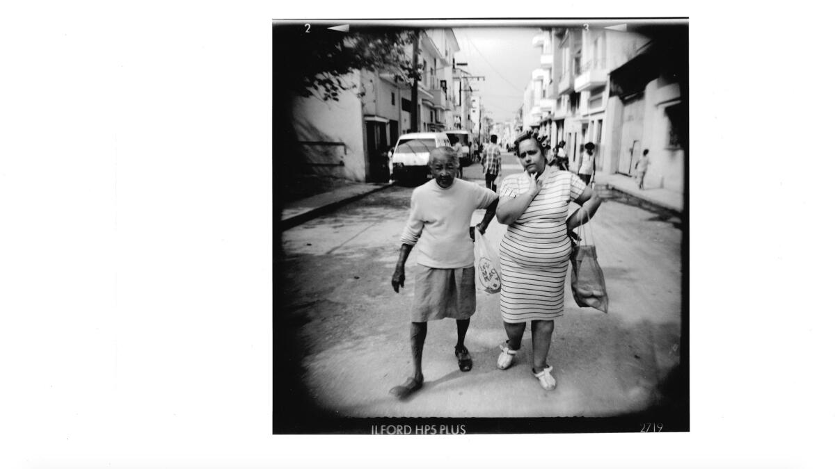 At Couturier Gallery, photographer David Stork's images from Cuba, all taken with a very cinematic Holga camera. Seen here: "Dos Mujeres," from 1999.