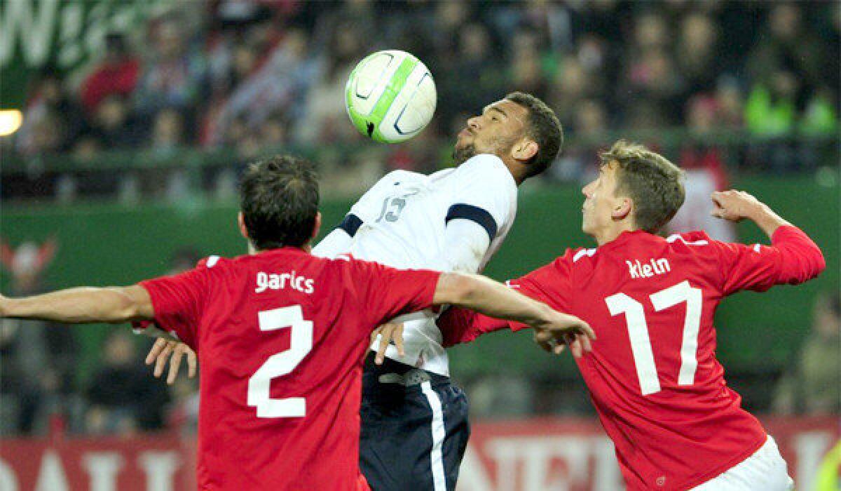 U.S. forward Terrence Boyd is surrounded by Austrian defenders Gyoergy Garics, left, and Florian Klein, right, during a friendly soccer match between Austria and the U.S. on Tuesday. Austria defeated the U.S., 1-0.