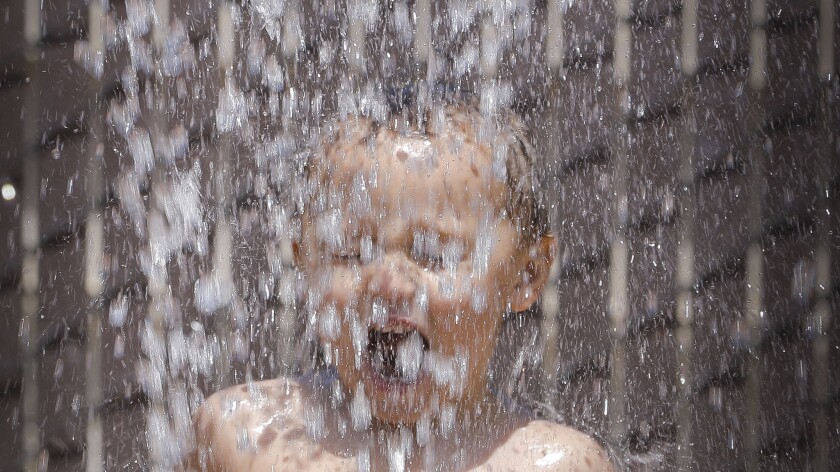 Jackson Taylor, 3, cooled off at the Sprayground at Santee Lakes on Tuesday.