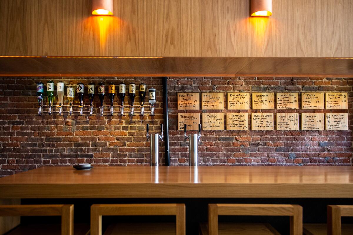 The Shochu pour line, and the bar at Ototo, a sake bar in Echo Park.