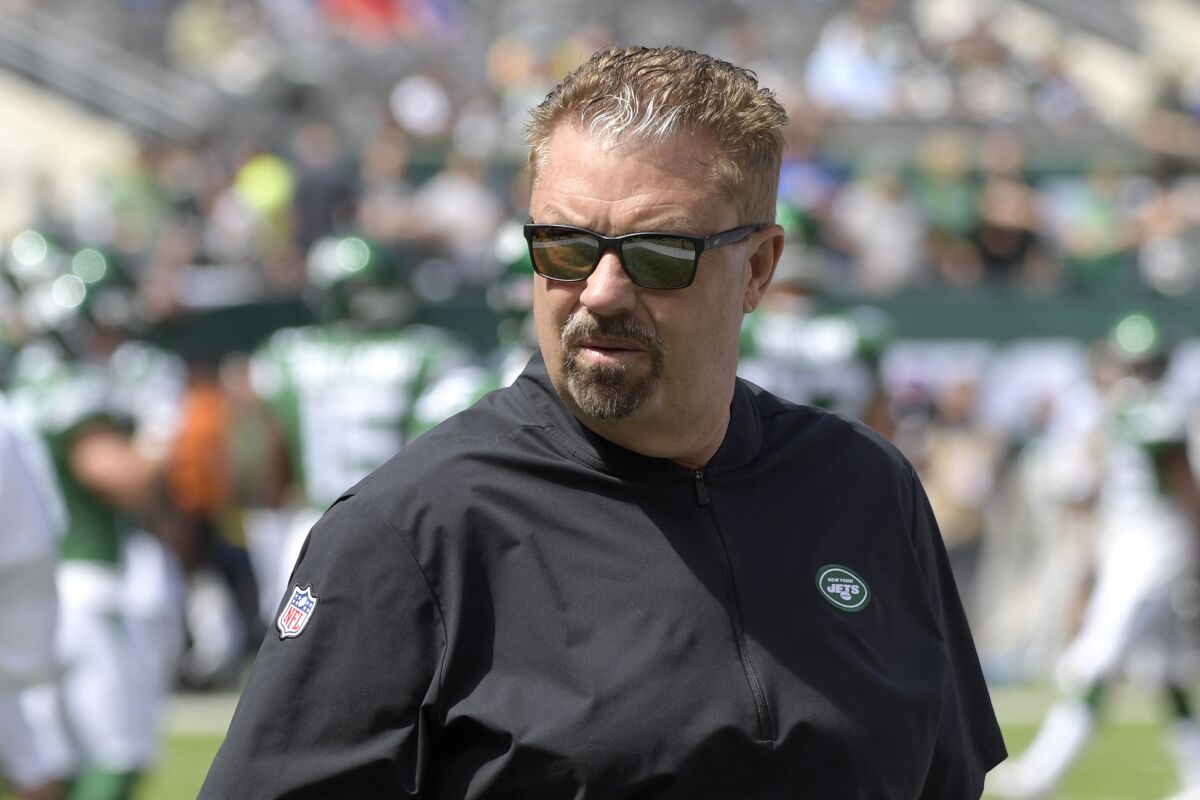 FILE - In this Sept. 8, 2019, file photo, New York Jets defensive coordinator Gregg Williams looks on before an NFL football game against the Buffalo Bills, in East Rutherford, N.J. Gregg Williams has made a career of adjusting on the fly, mixing and matching players to regularly field one of the NFL's toughest defenses. The New York Jets defensive coordinator certainly has his hands full this season after losing his two best players with Jamal Adams traded, and C.J. Mosley choosing to opt out because of the coronavirus pandemic. But, in typical fashion, Williams isn't sweating it - at all. (AP Photo/Bill Kostroun, File)