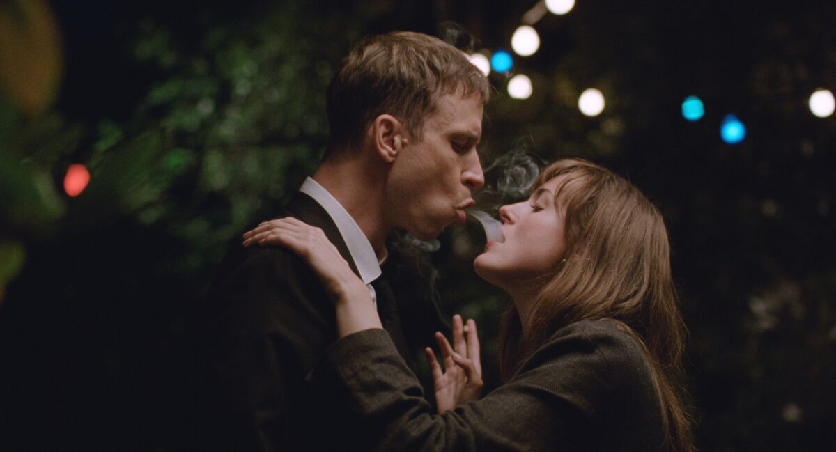 Herbert Nordrum and Renate Reinsve lean in for a kiss in "The Worst Person in the World."