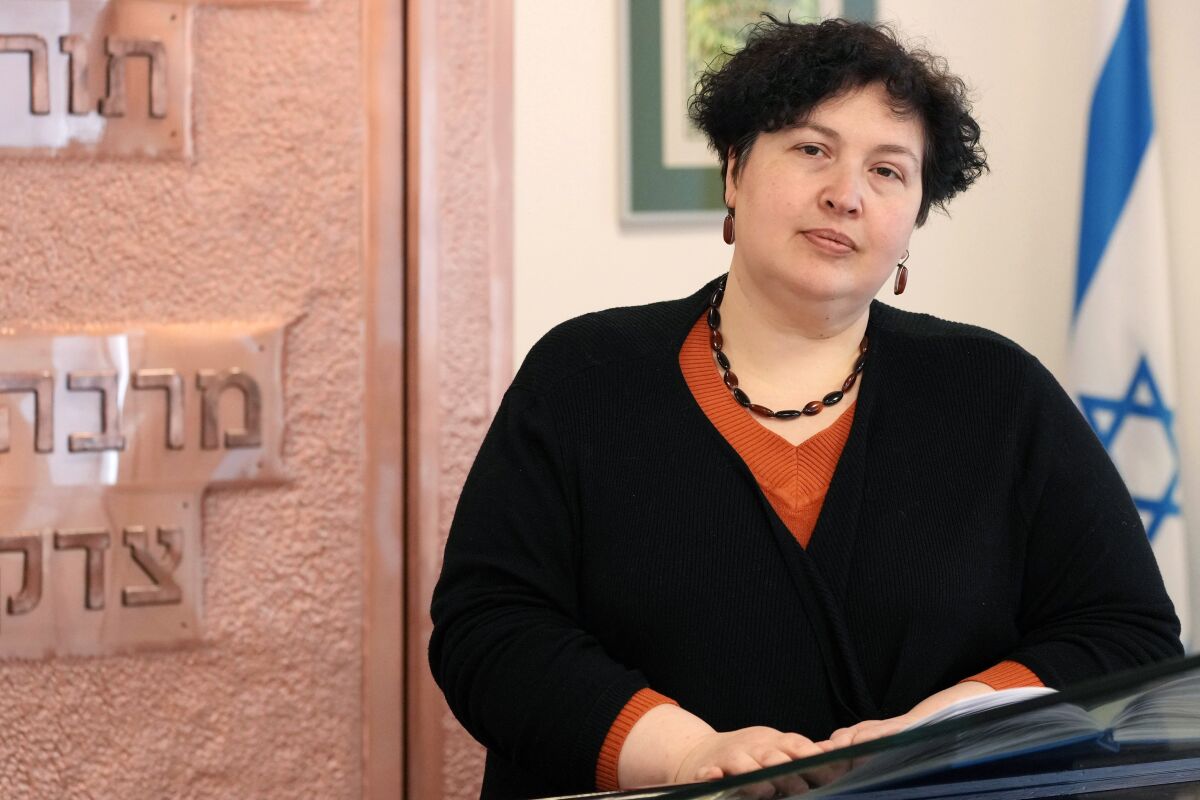 Rabbi Julia Gris, who led a Progressive Jewish congregation in Odessa, Ukraine, visits a synagogue in Warsaw, Poland, Saturday, March 12, 2022. Many Jews are among the more than 2.5 million refugees leaving Ukraine. International Jewish organizations have mobilized to help, working with local Jewish communities in Poland, Romania, Moldova and elsewhere to organize food, shelter, medical care and other assistance. Among them is Rabbi Gris, Ukraine's only woman rabbi, who these days leads online Shabbat services for her scattered congregation. (AP Photo/Czarek Sokolowski)