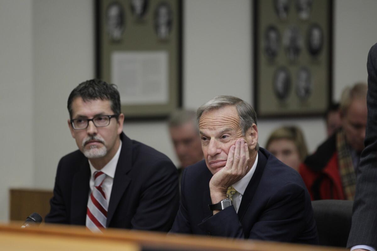 Former San Diego Mayor Bob Filner, right, sits with Earll Pott, a member of his defense team, in Superior Court Judge Robert J. Trentacosta's courtroom on Monday. Filner was sentenced to three months of home confinement and three years of probation for harassing women while he was mayor of San Diego.