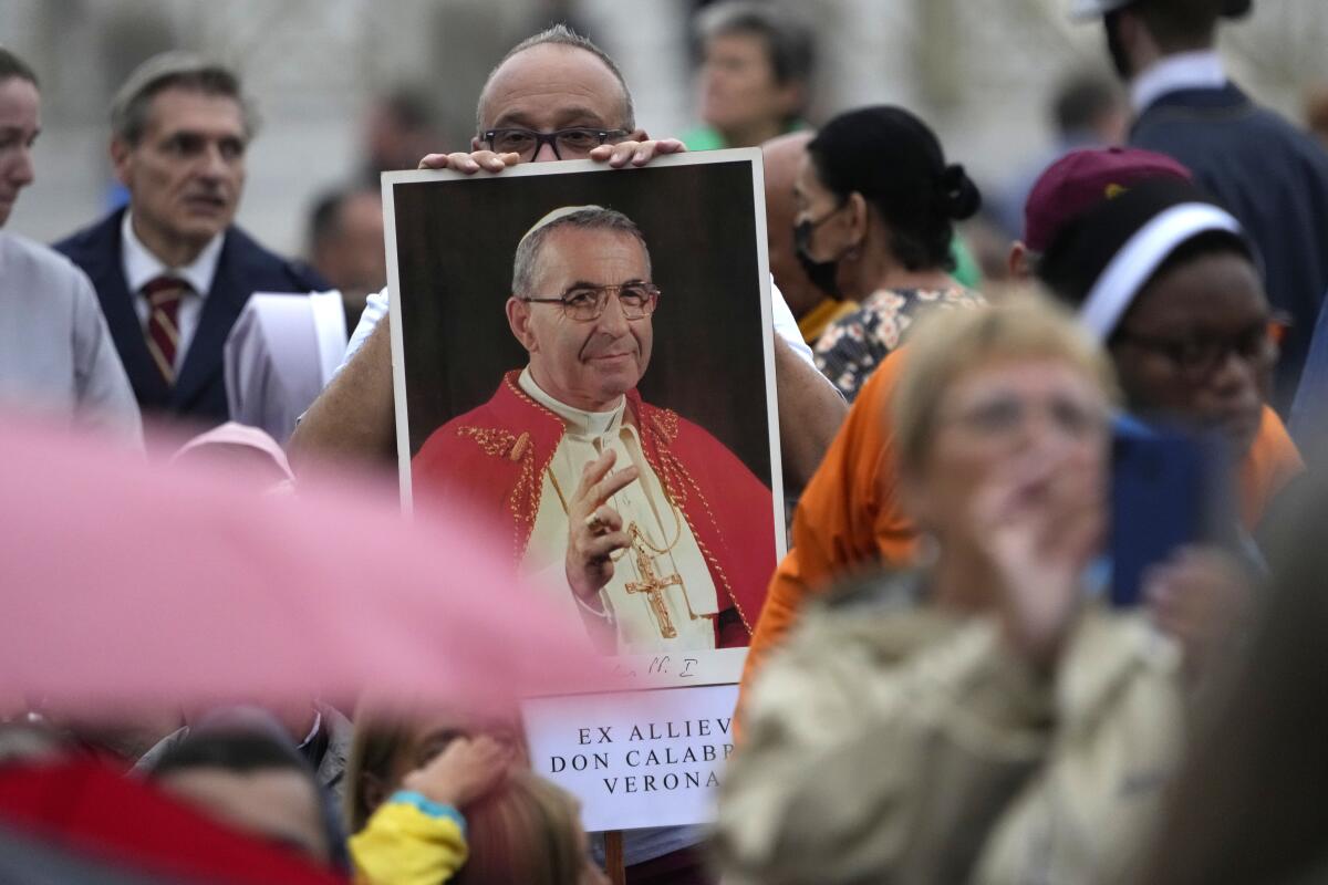 A photo of Pope John Paul I is displayed during a beatification ceremony led by Pope Francis at the Vatican on Sunday.