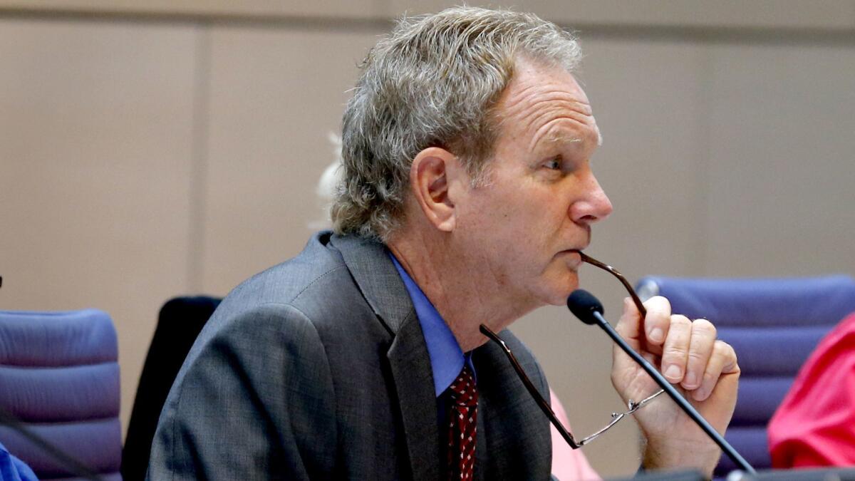 Steve Kinsey listens to comments during a California Coastal Commission hearing in 2016. Kinsey was recently fined $30,300 for rules violations.